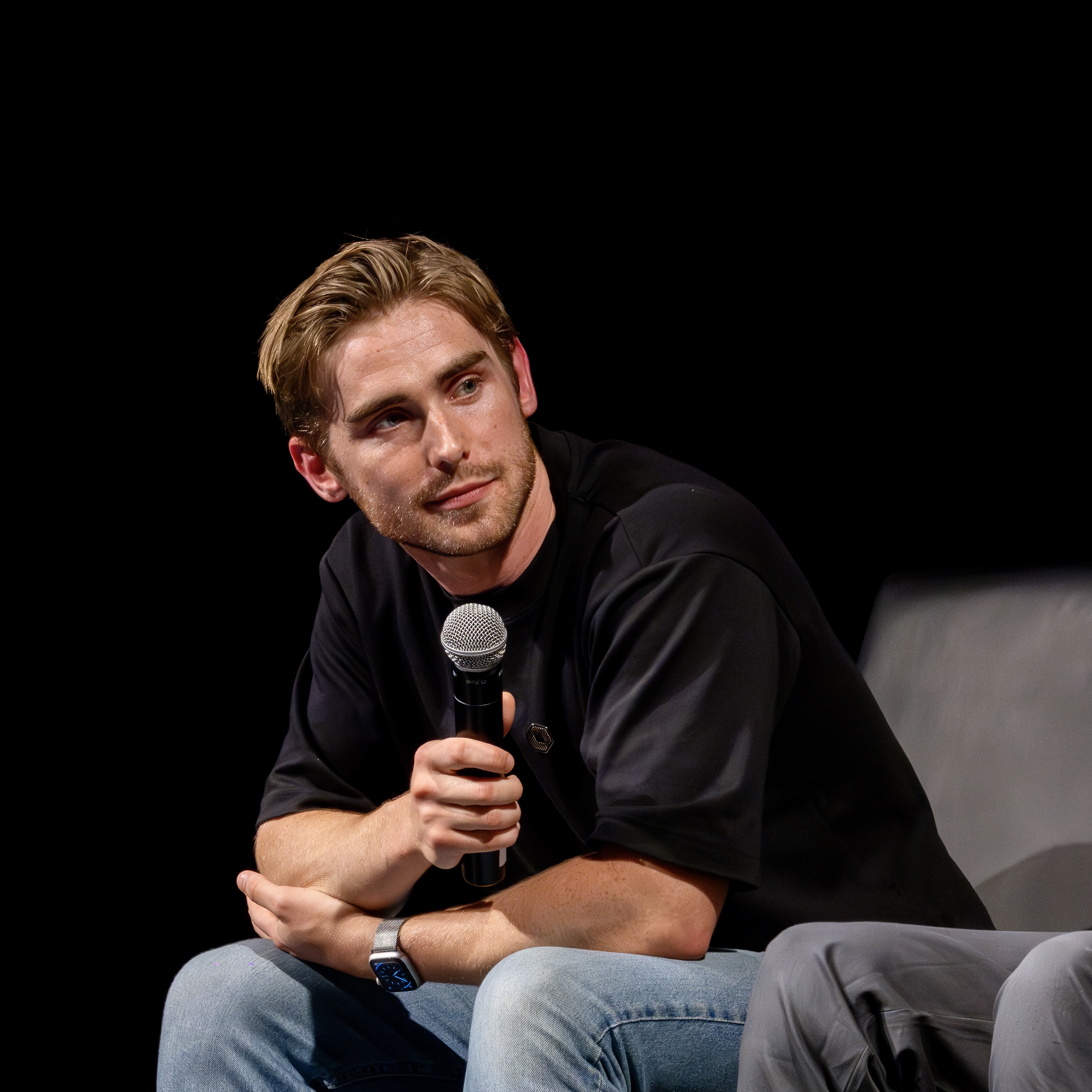 Tobin South moderating AI safety panel discussion at academic conference